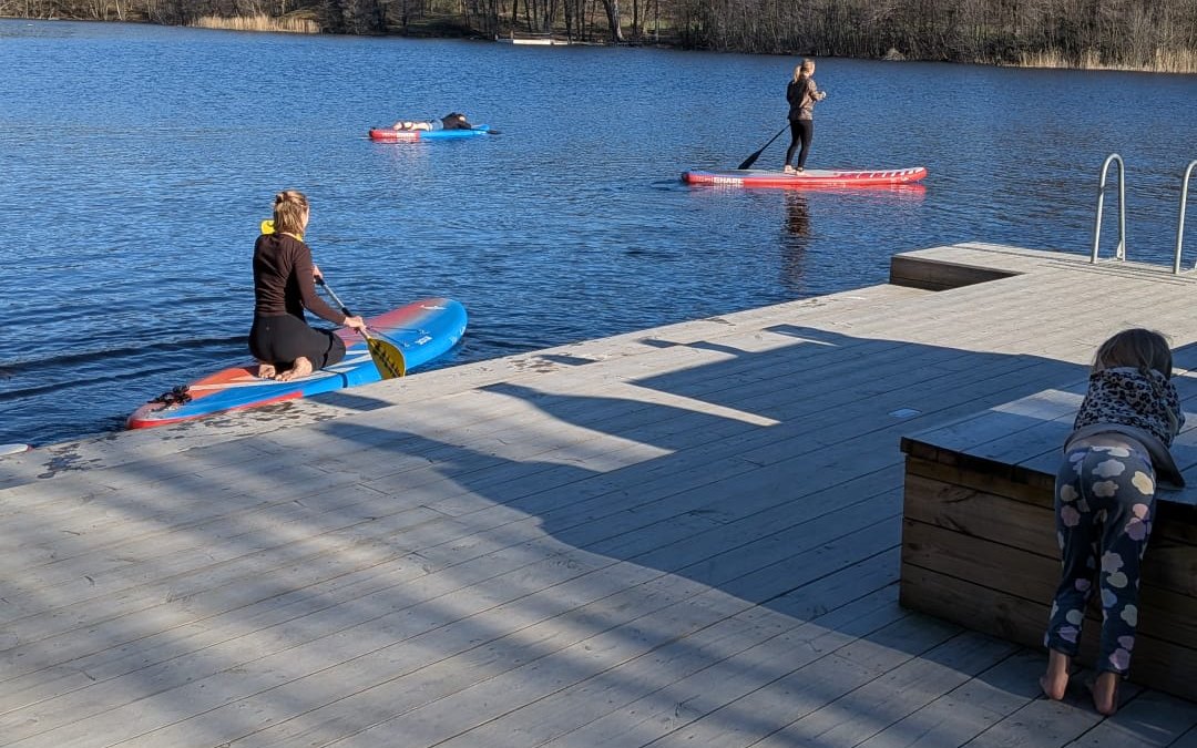Paddleboards by the dock at Sickla Strand