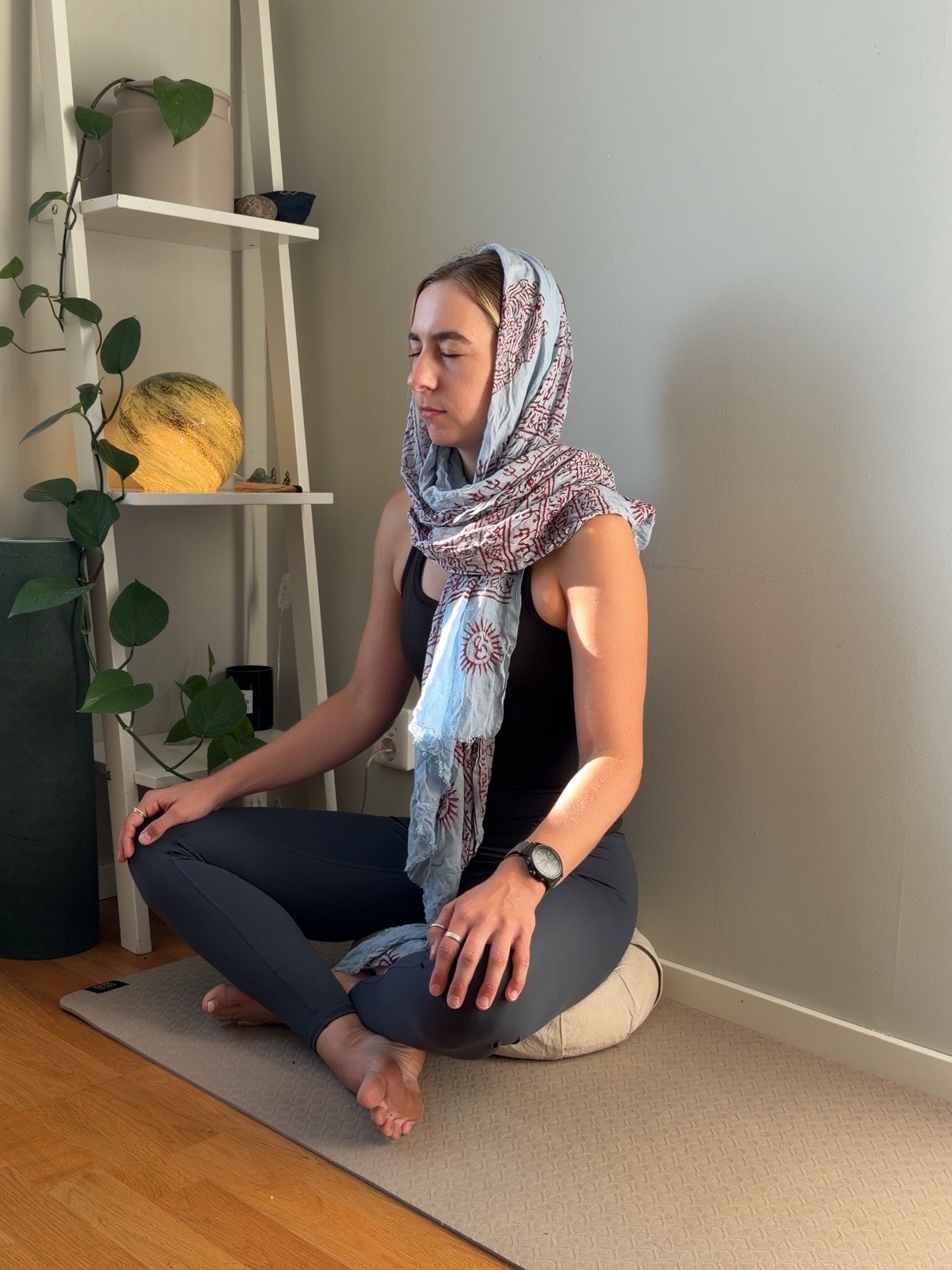 Camilla Tilly, yoga teacher in Stockholm, seated in meditation