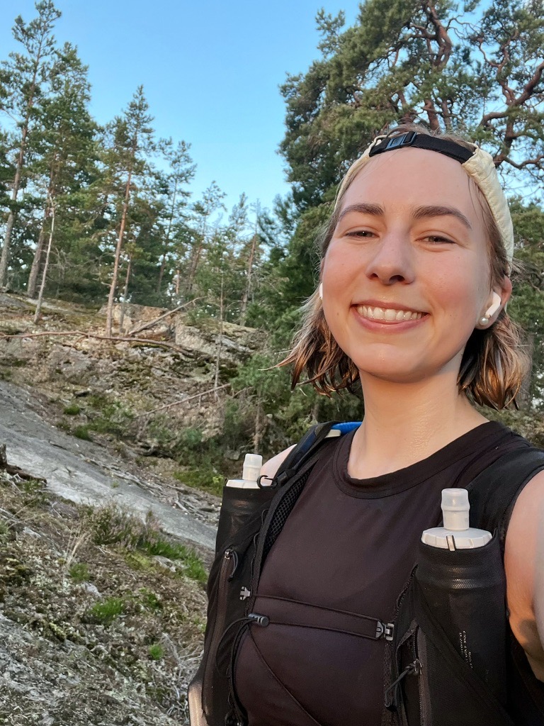 Camilla on a trail run in the Swedish forest